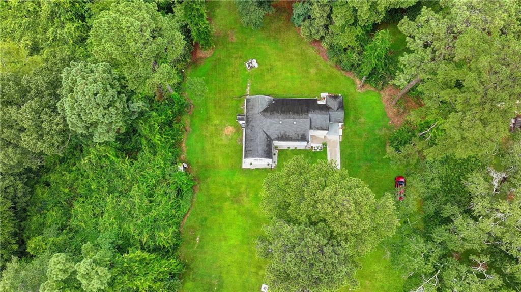 6654 Covington Road Lithonia, GA 30058 - Photo 35 of 39 an aerial view of a house with a yard