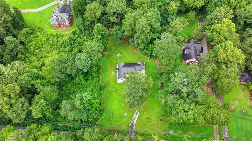 6654 Covington Road Lithonia, GA 30058 - Photo 36 of 39 an aerial view of a house with a yard