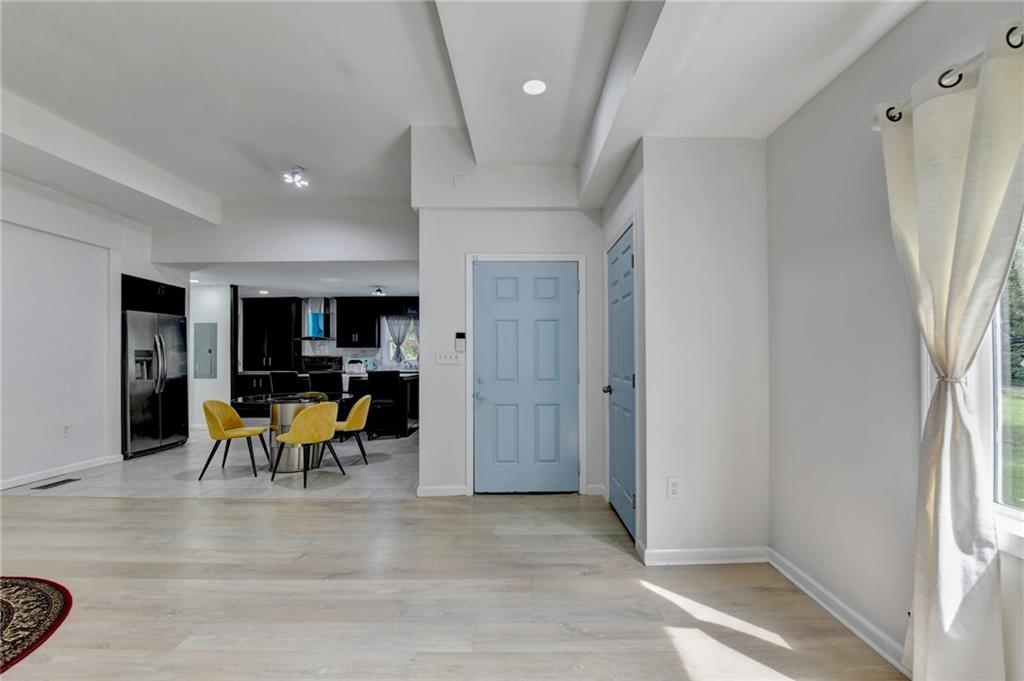 6654 Covington Road Lithonia, GA 30058 - Photo 4 of 39 wooden view of a living room and dining room