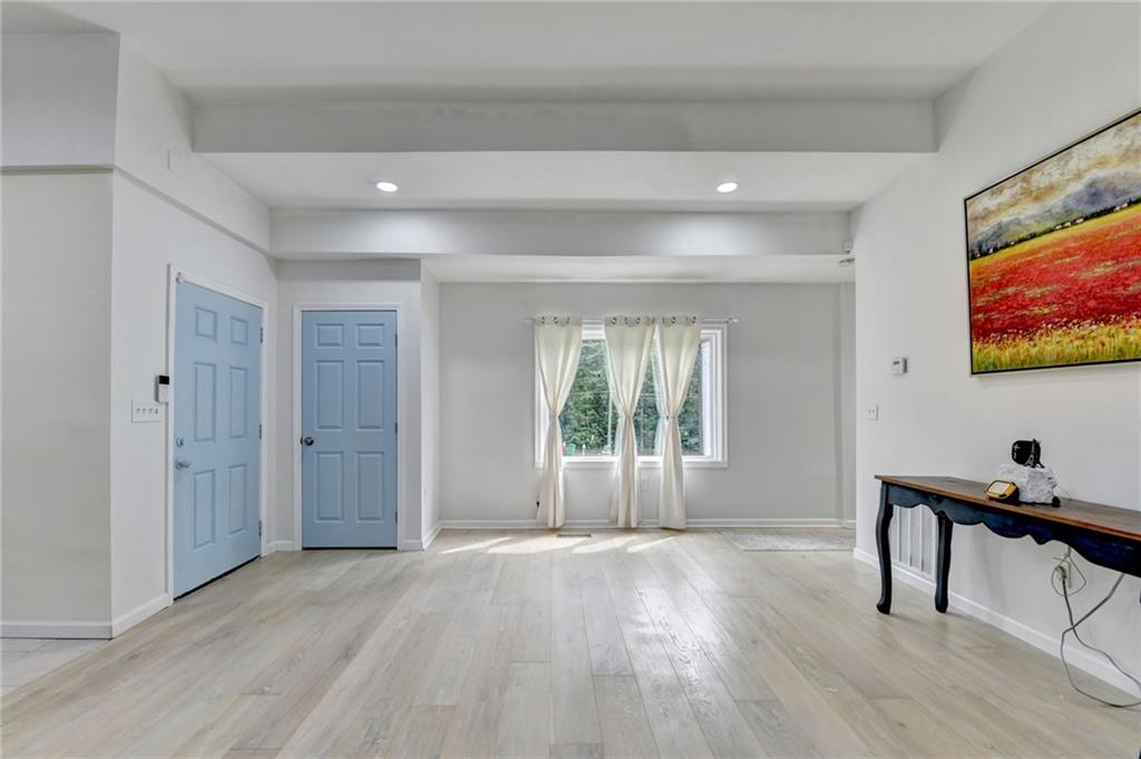 6654 Covington Road Lithonia, GA 30058 - Photo 8 of 39 a view of an empty room with a window