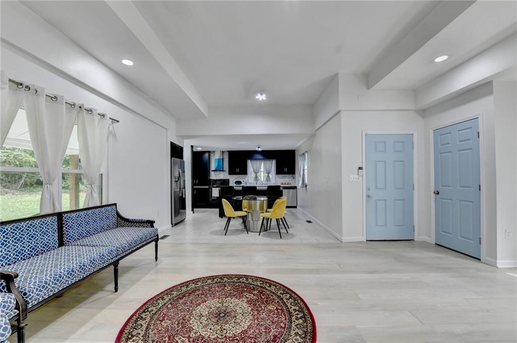6654 Covington Road Lithonia, GA 30058 - Photo 9 of 39 a view of a livingroom with furniture and window