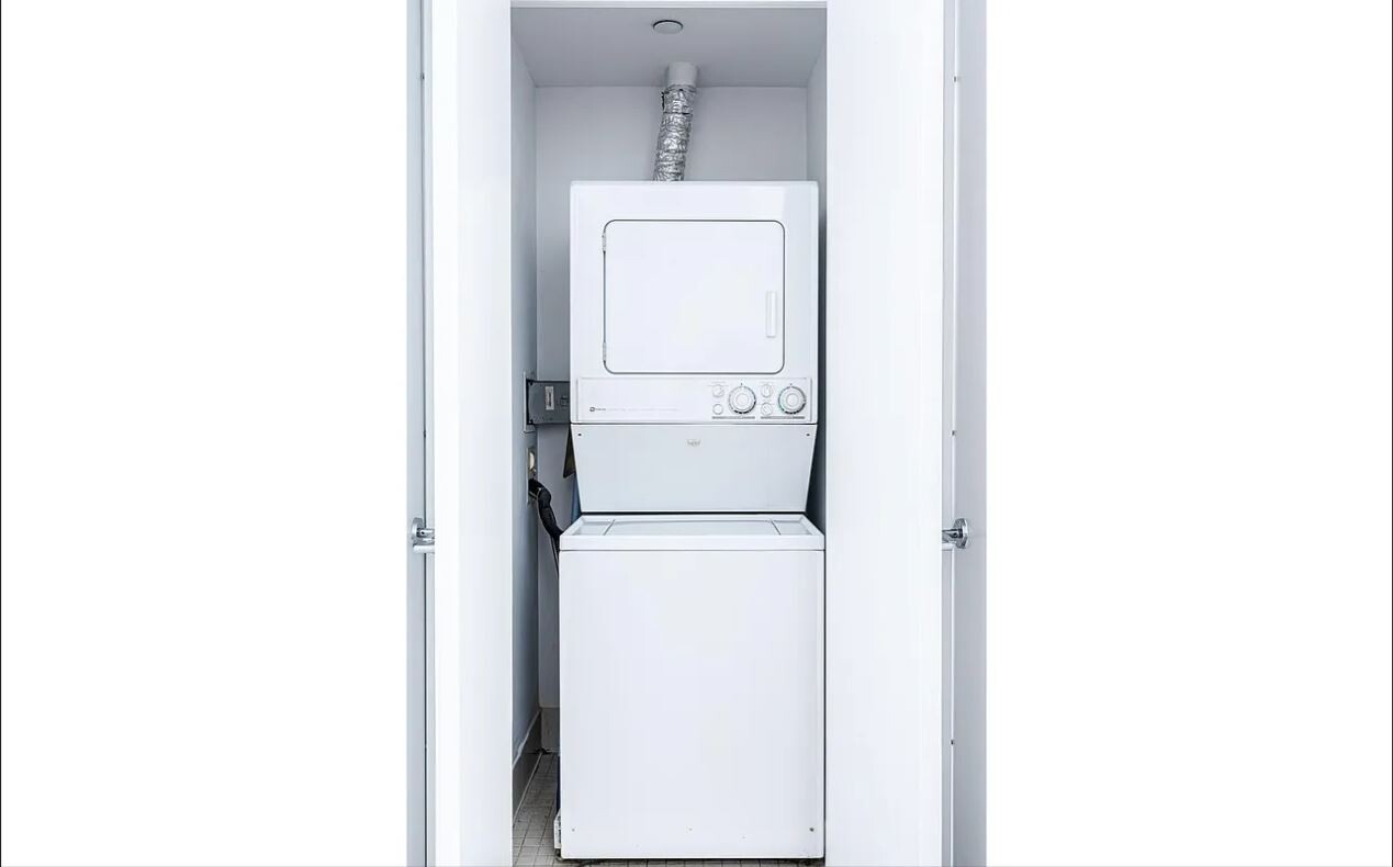 120 Riverside Boulevard, Unit 8V Manhattan, NY 10069 - Photo 7 of 9 a utility room with dryer and washer