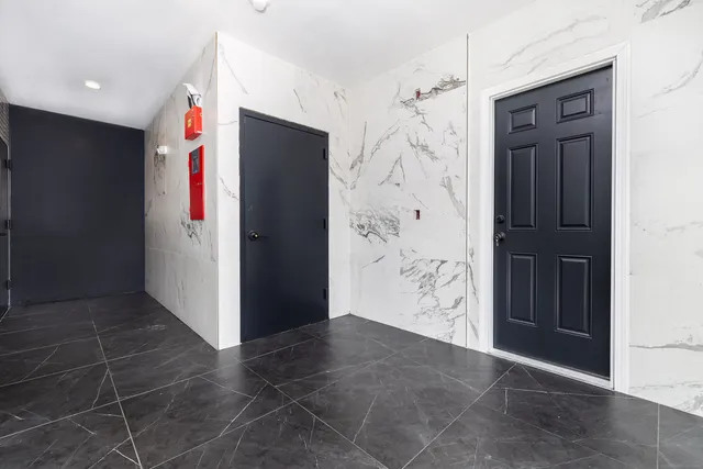 an empty room with an entryway door