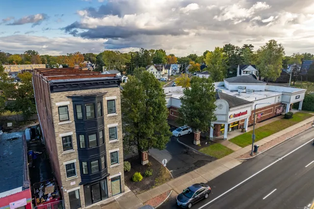 a aerial view of a houses with street