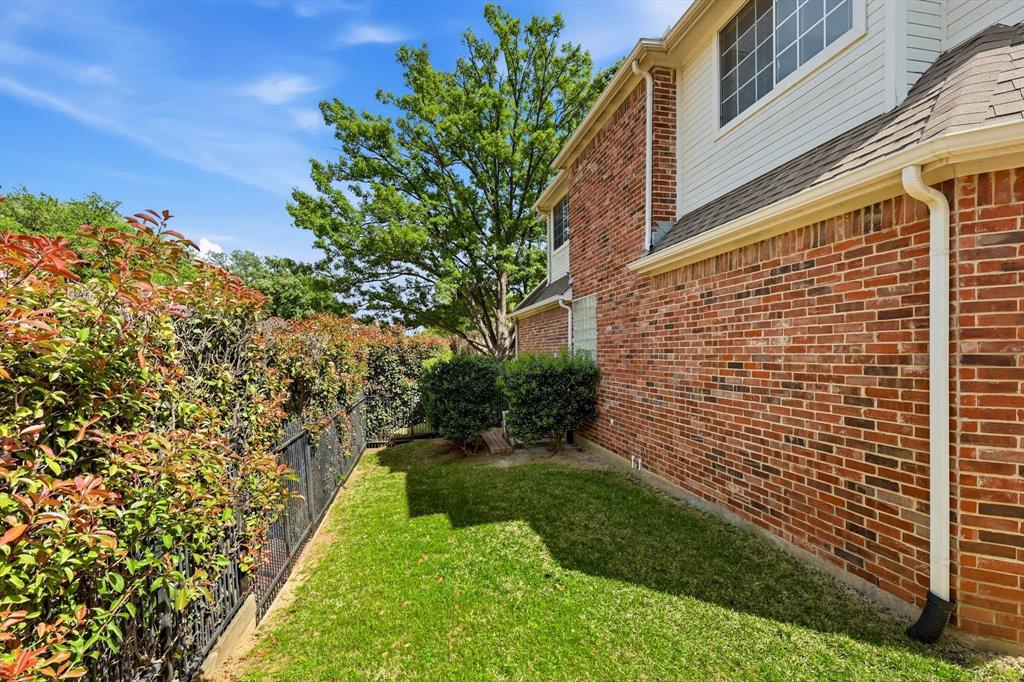 117 Portside Lane Coppell, TX 75019 - Photo 36 of 37 A side yard with extra green space that adds flexibility for pets, play, or simply a little more room to spread out.