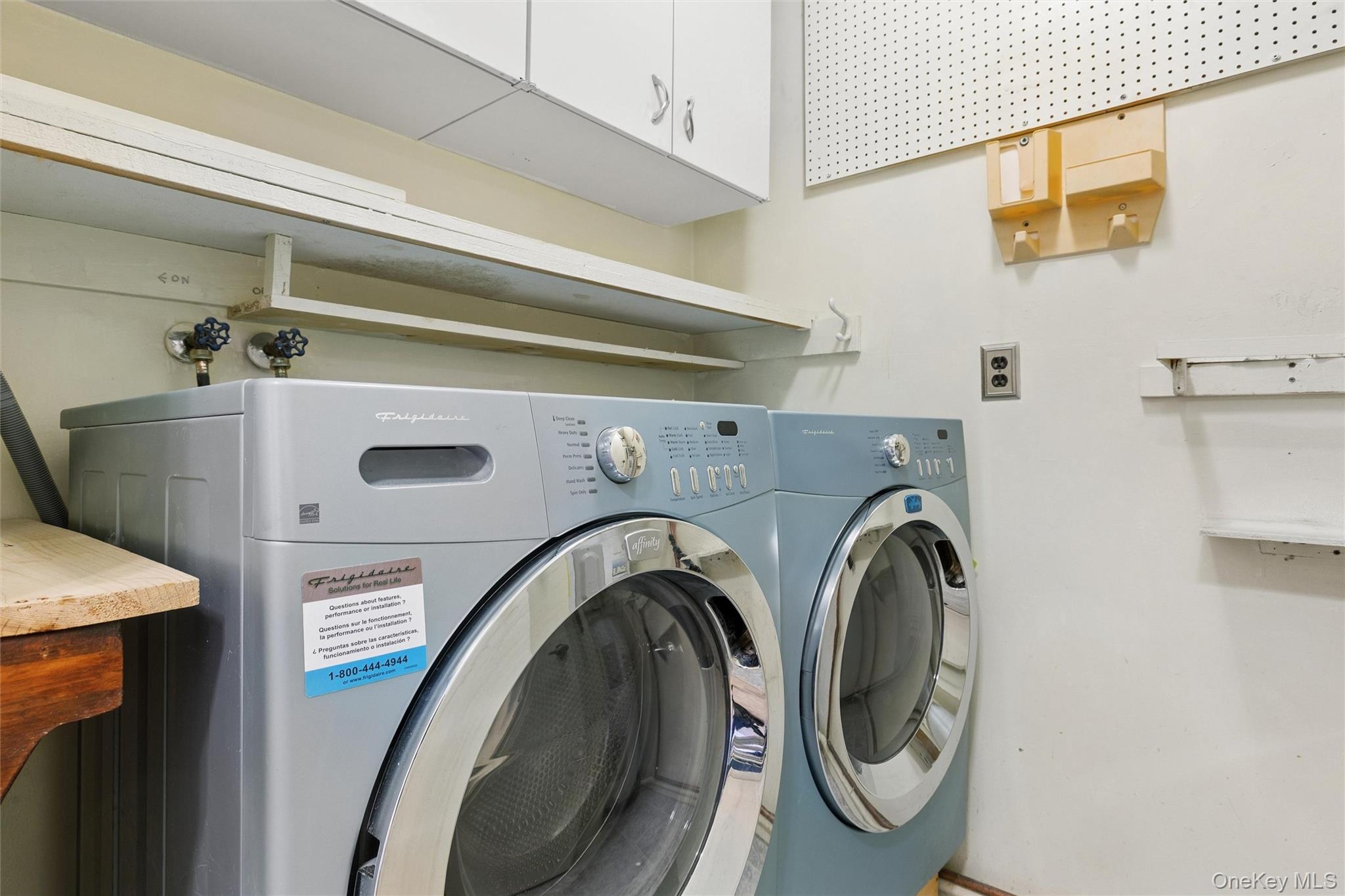 8 Coventry Court Ridge, NY 11961 - Photo 17 of 21 a utility room with dryer and washer