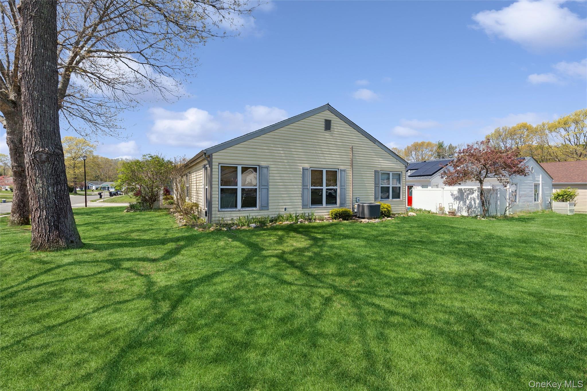 8 Coventry Court Ridge, NY 11961 - Photo 19 of 21 a front view of house with yard and green space