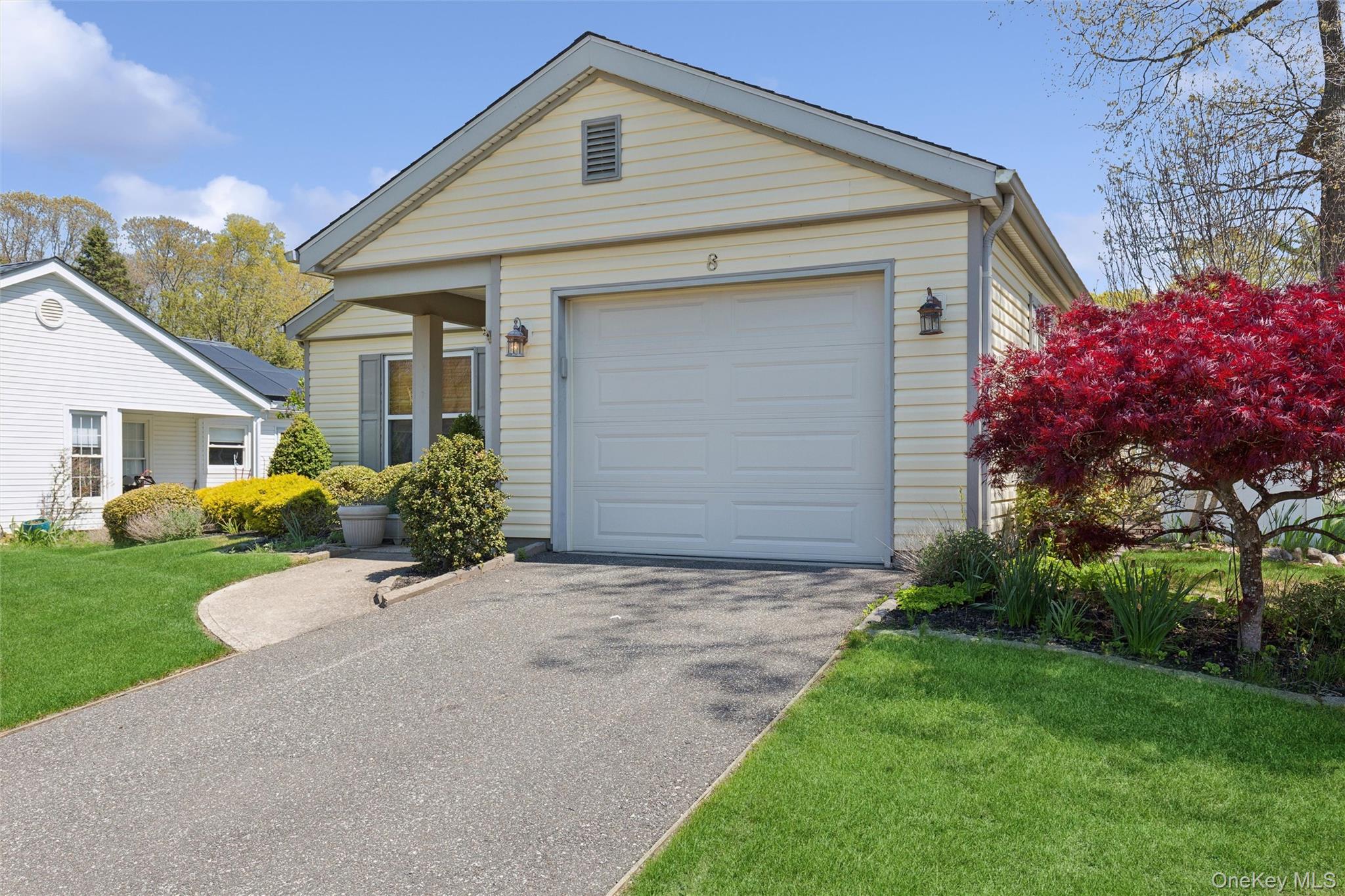 8 Coventry Court Ridge, NY 11961 - Photo 3 of 21 a front view of house with yard and trees