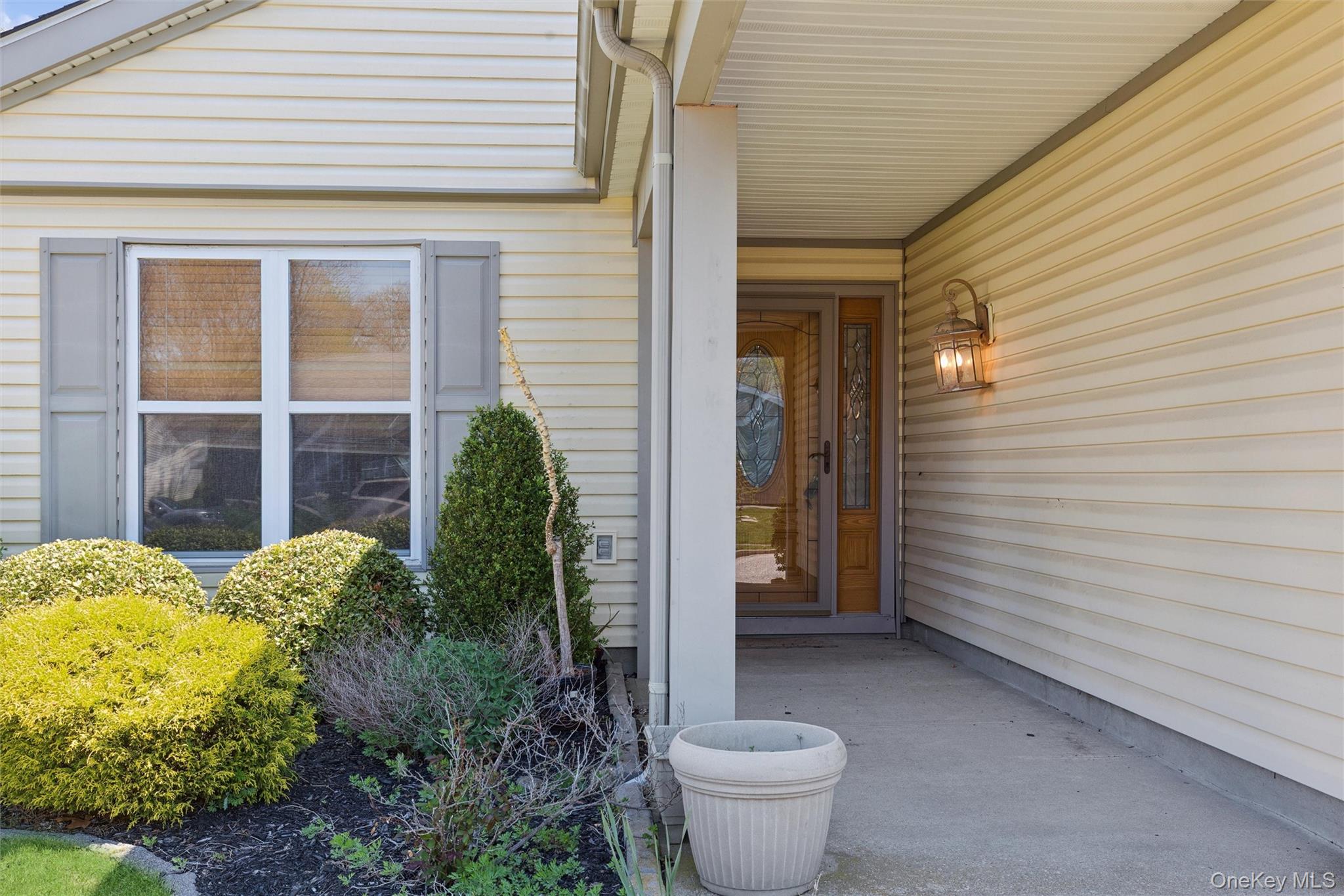 8 Coventry Court Ridge, NY 11961 - Photo 4 of 21 a view of a porch of the house