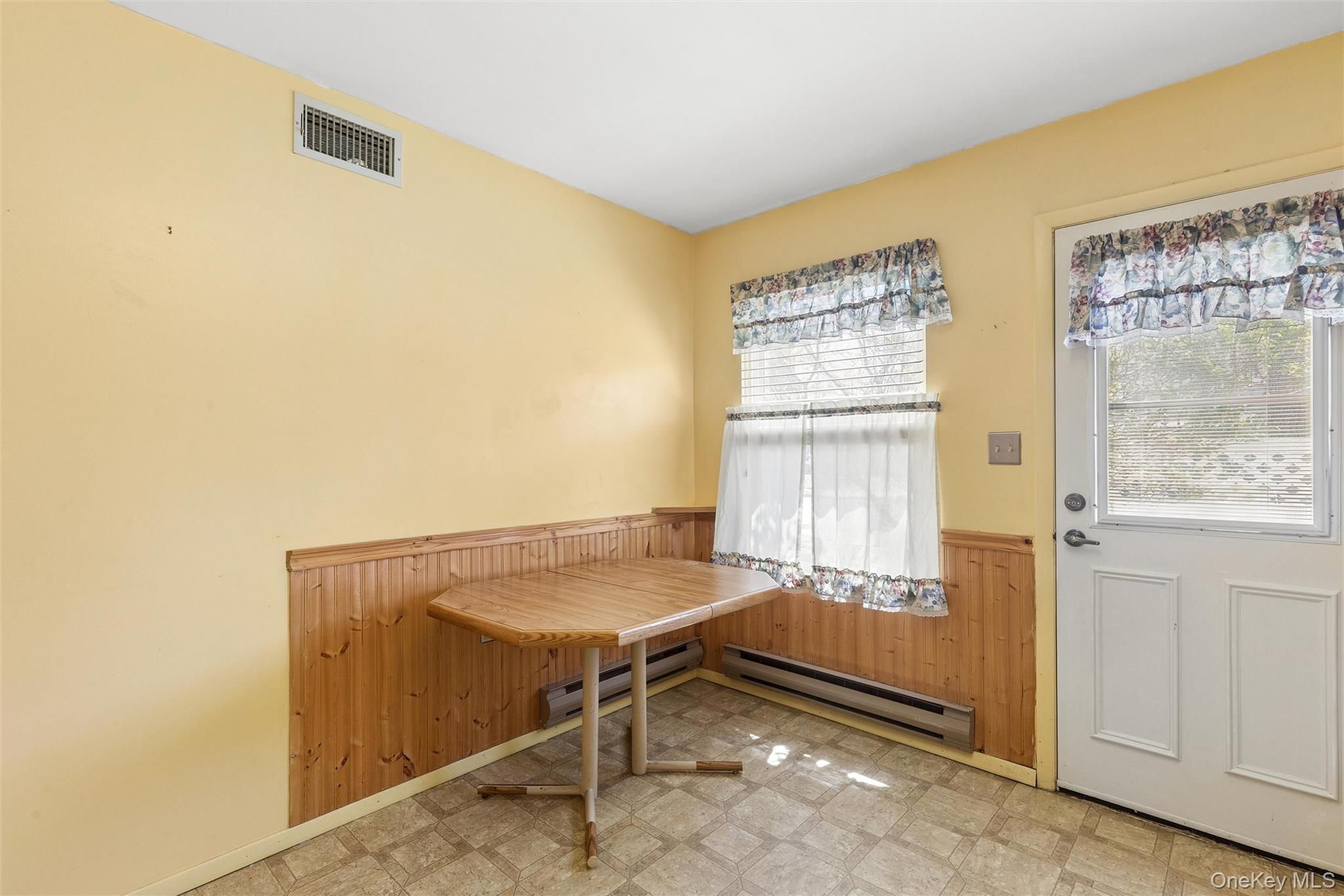 8 Coventry Court Ridge, NY 11961 - Photo 7 of 21 a room with table and window