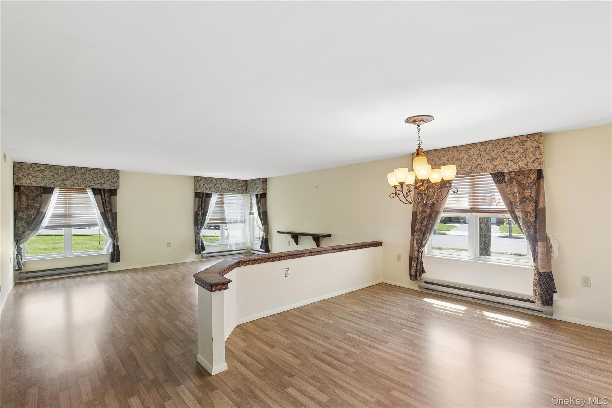 8 Coventry Court Ridge, NY 11961 - Photo 10 of 21 a view of empty room with wooden floor and fan