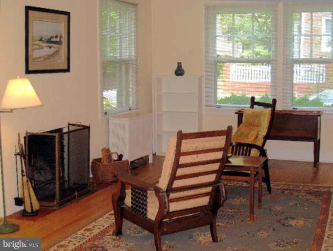 3926 Cloverhill Road Baltimore, MD 21218 - Photo 14 of 24 a view of a workspace with furniture and a window