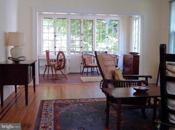 3926 Cloverhill Road Baltimore, MD 21218 - Photo 15 of 24 a view of a dining room with furniture window and wooden floor