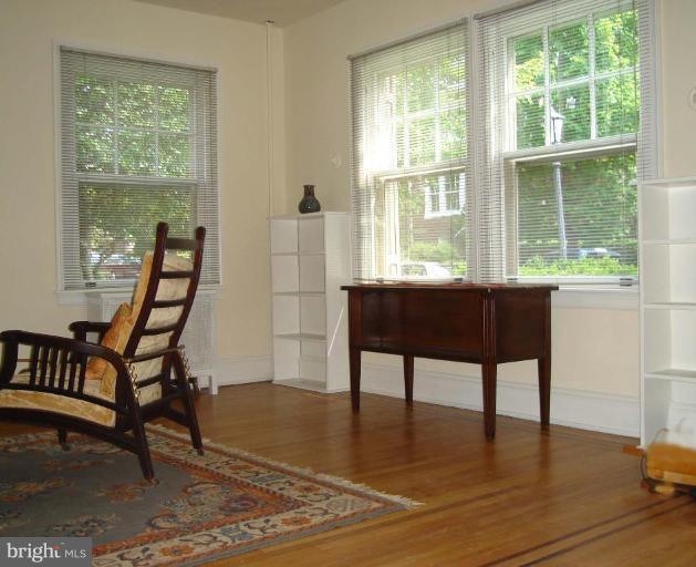 3926 Cloverhill Road Baltimore, MD 21218 - Photo 16 of 24 a dining room with furniture and windows