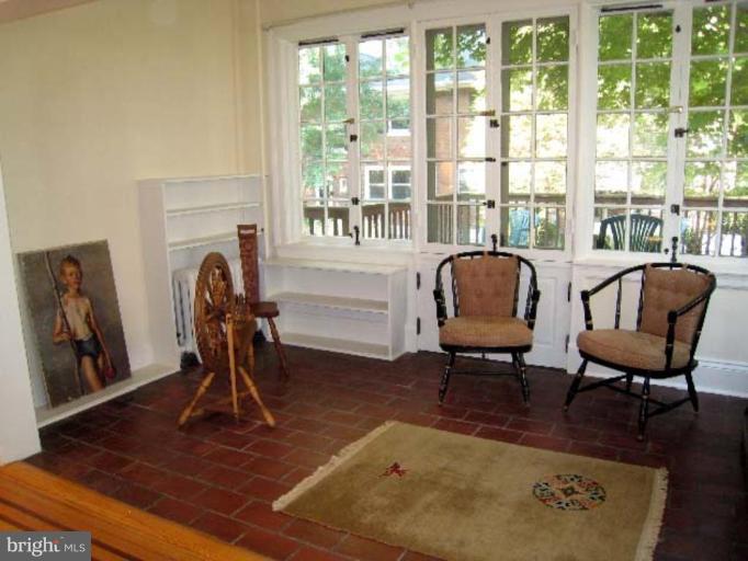 3926 Cloverhill Road Baltimore, MD 21218 - Photo 22 of 24 a view of a livingroom with furniture and a window