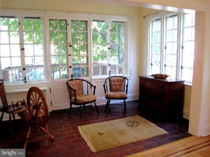 3926 Cloverhill Road Baltimore, MD 21218 - Photo 23 of 24 a living room with furniture and a window