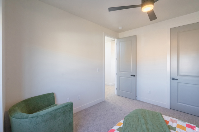 2972 West 570 North Hurricane, UT 84737 - Photo 70 of 104 Bedroom with light carpet and a ceiling fan