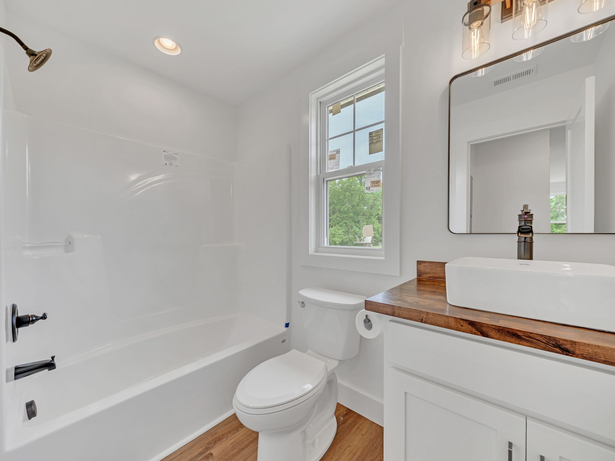 5800 Sanders Road Lyles, TN 37098 - Photo 21 of 28 a bathroom with a sink toilet vanity and bathtub