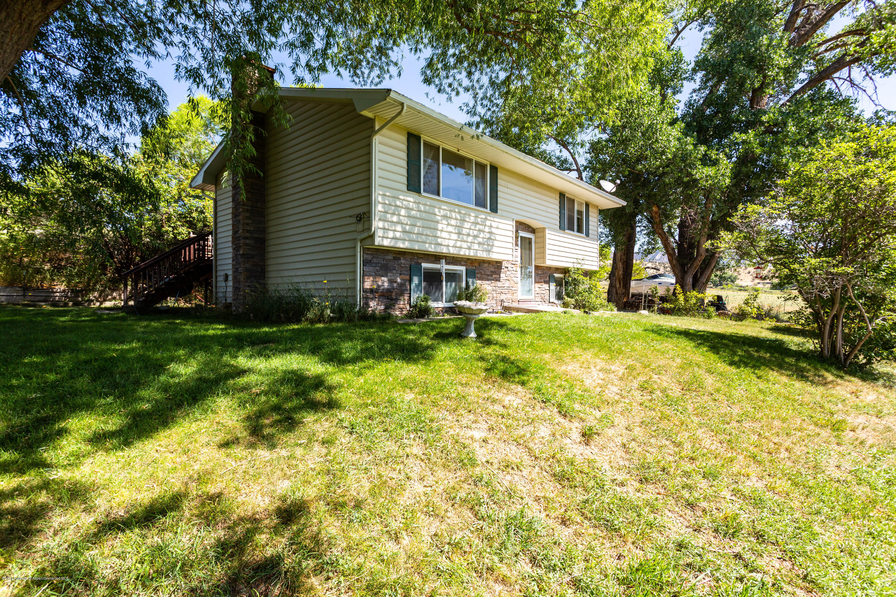 535 County Road 260 Rifle, CO 81650 - Photo 1 of 18 a view of a house with a yard