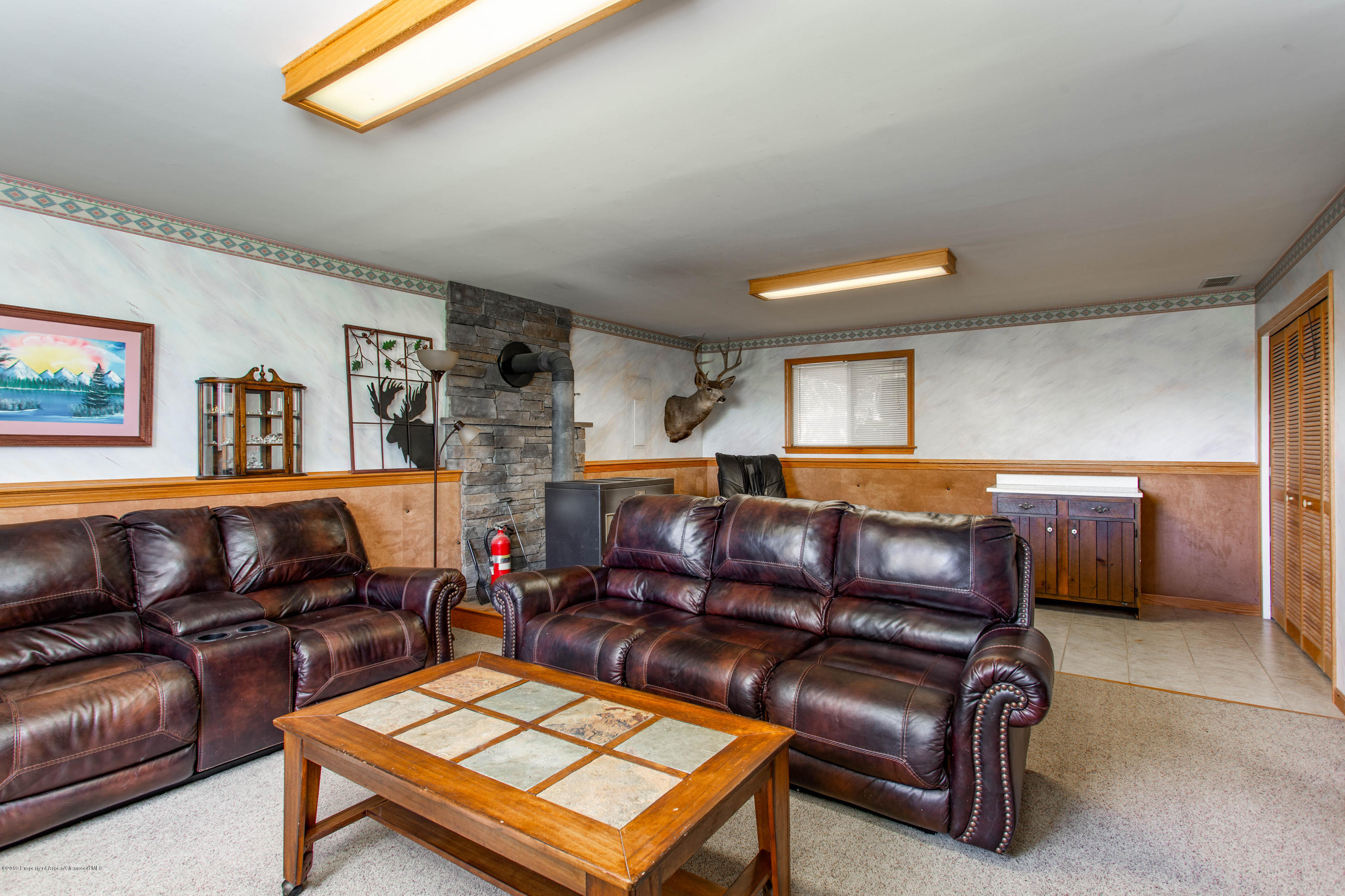 535 County Road 260 Rifle, CO 81650 - Photo 16 of 18 a living room with furniture a ceiling fan and a window