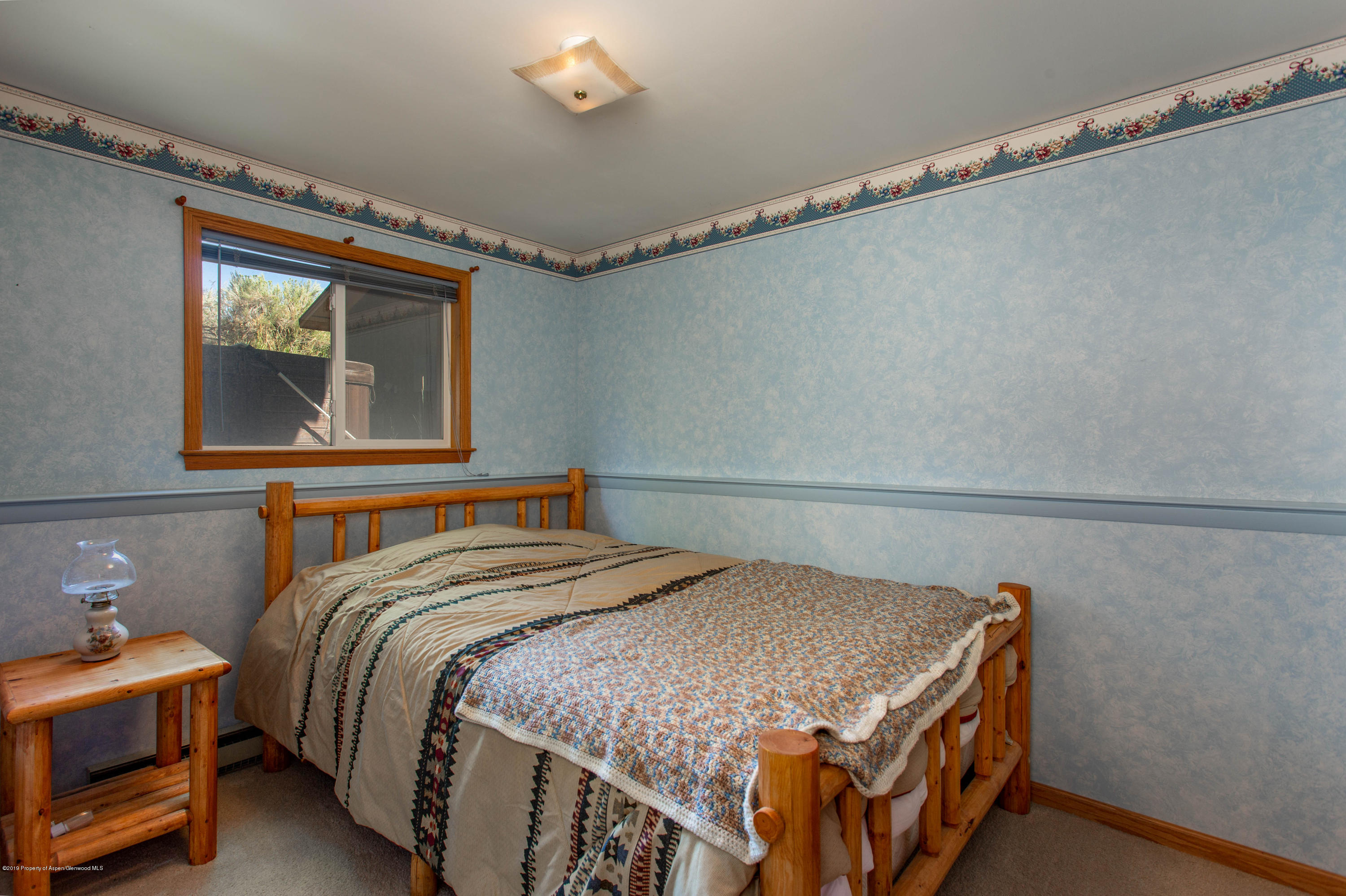 535 County Road 260 Rifle, CO 81650 - Photo 17 of 18 a bedroom with a bed and a mirror