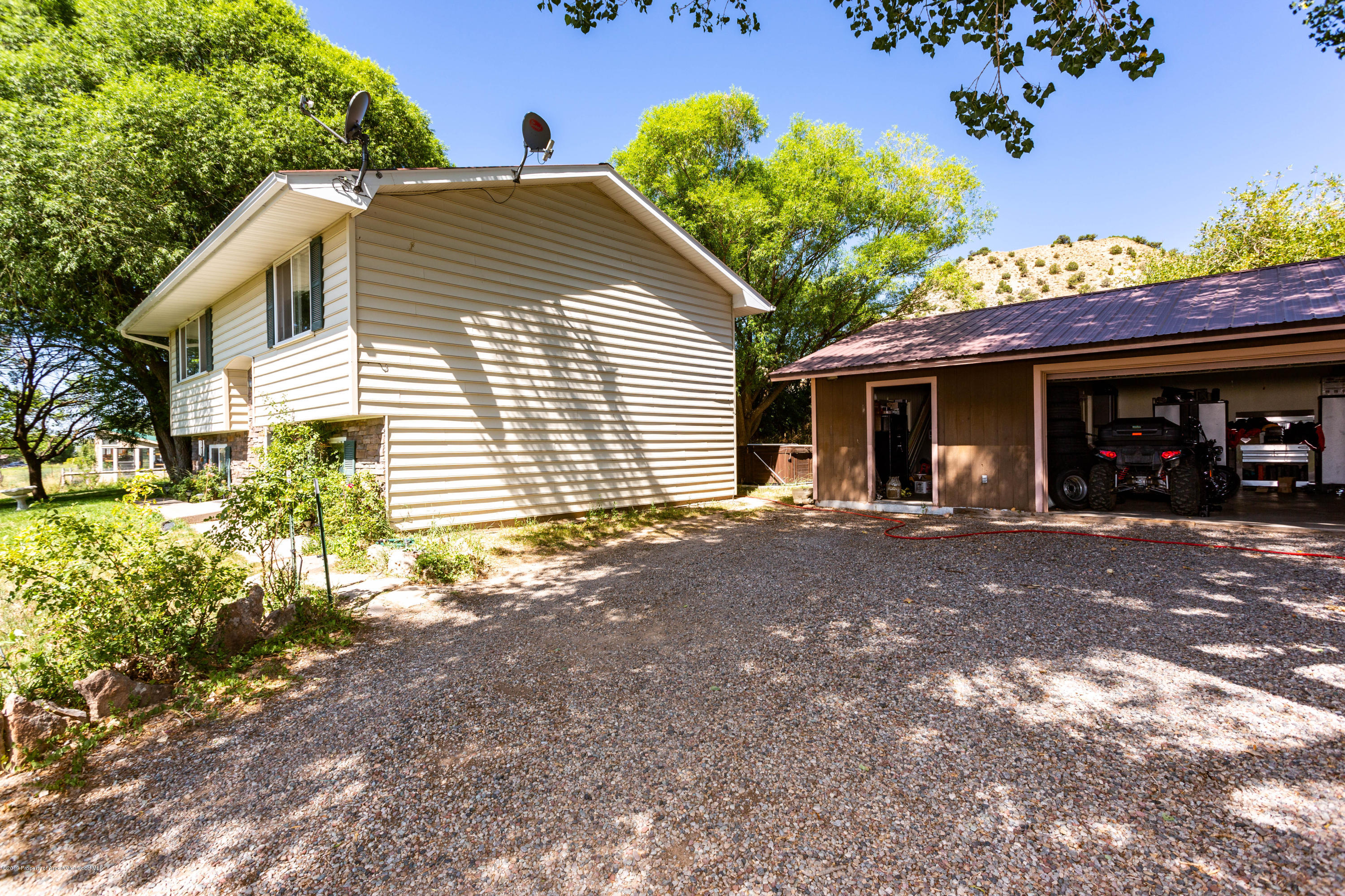 535 County Road 260 Rifle, CO 81650 - Photo 2 of 18 a front view of a house with a yard and potted plants