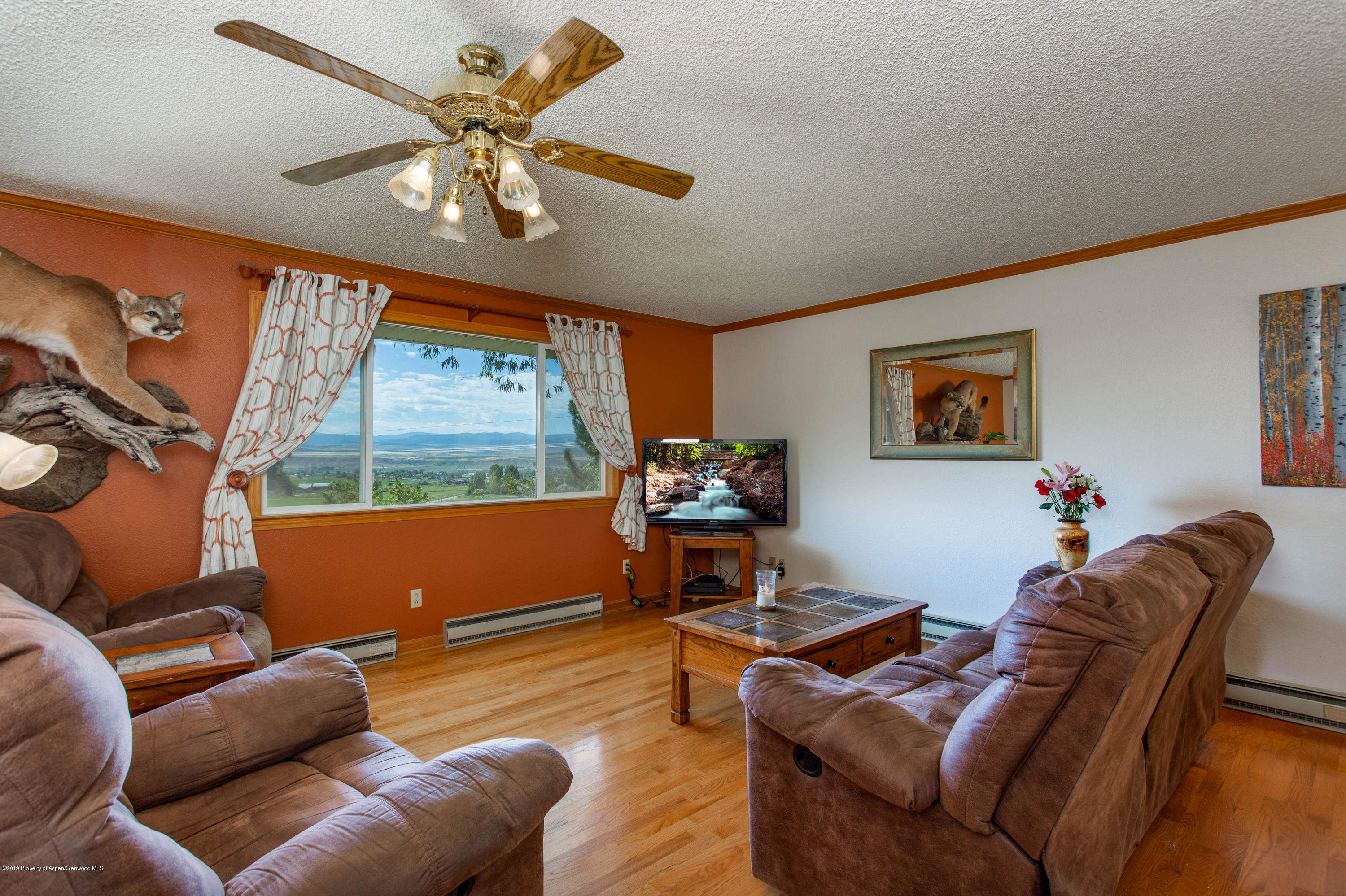 535 County Road 260 Rifle, CO 81650 - Photo 8 of 18 a living room with furniture and a large window