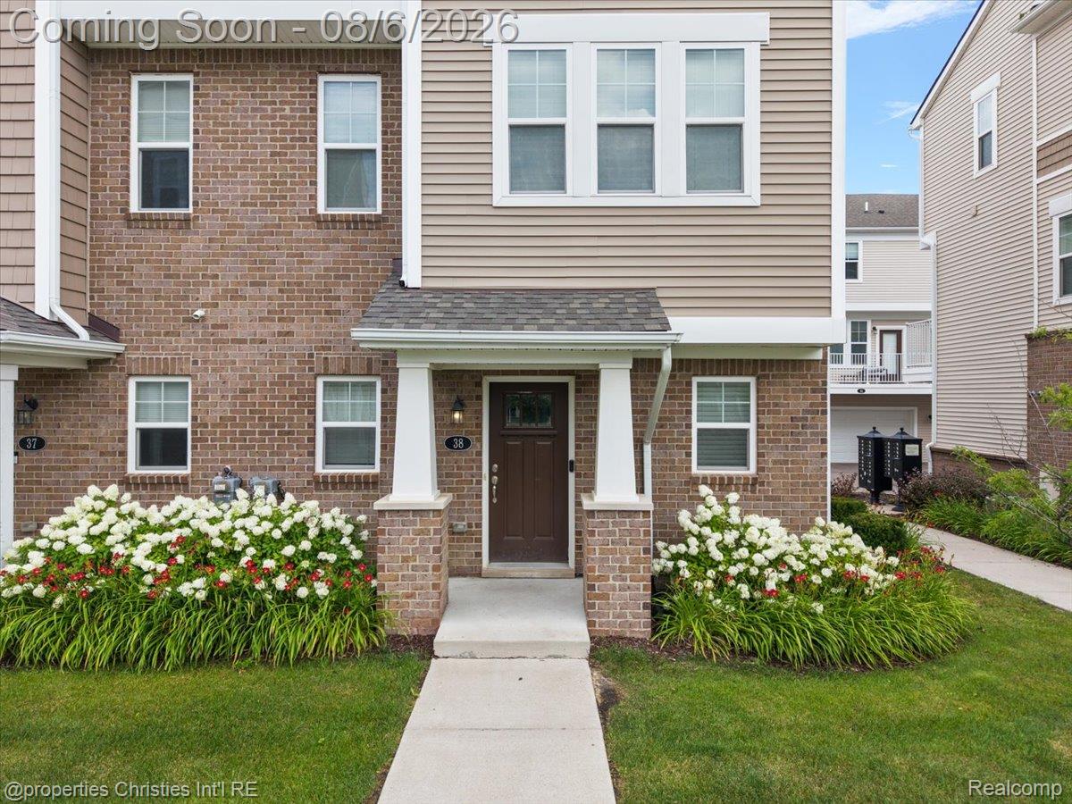 2500 Normandy Road, Unit 38 Royal Oak, MI 48073 - Photo 43 of 55 Contemporary townhome exterior featuring a brick and siding facade
