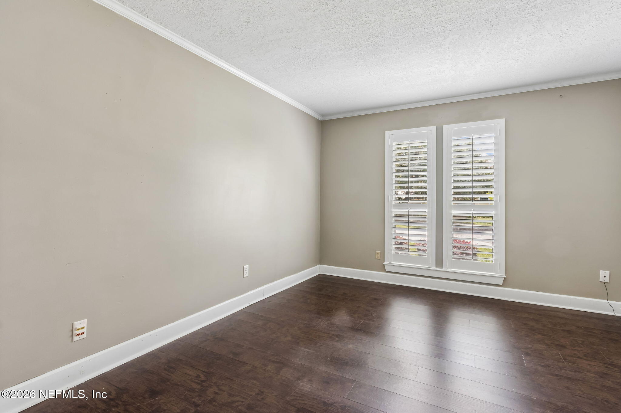 1877 Christopher Point Road South Jacksonville, FL 32217 - Photo 16 of 27 wooden floor in an empty room with a window