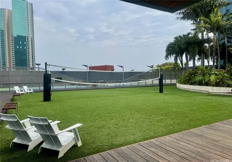 a view of a wooden deck and a yard