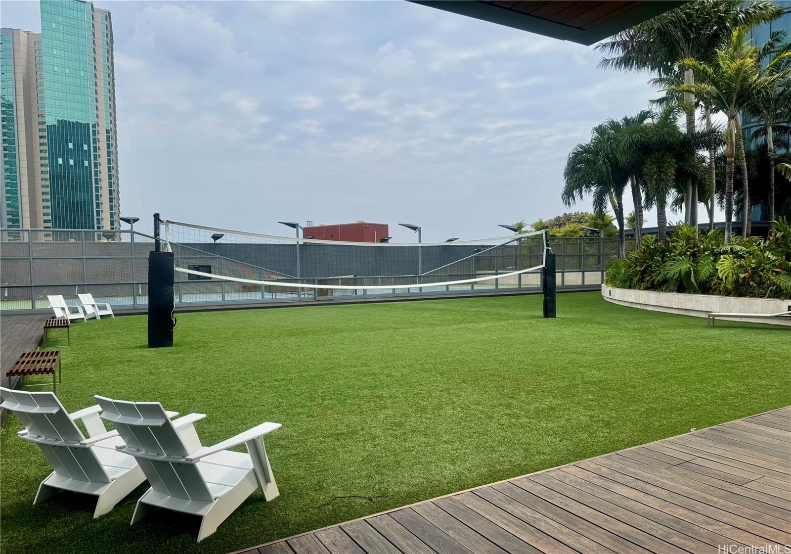 1108 Auahi Street, Unit 307 Honolulu, HI 96814 - Photo 18 of 23 a view of a wooden deck and a yard