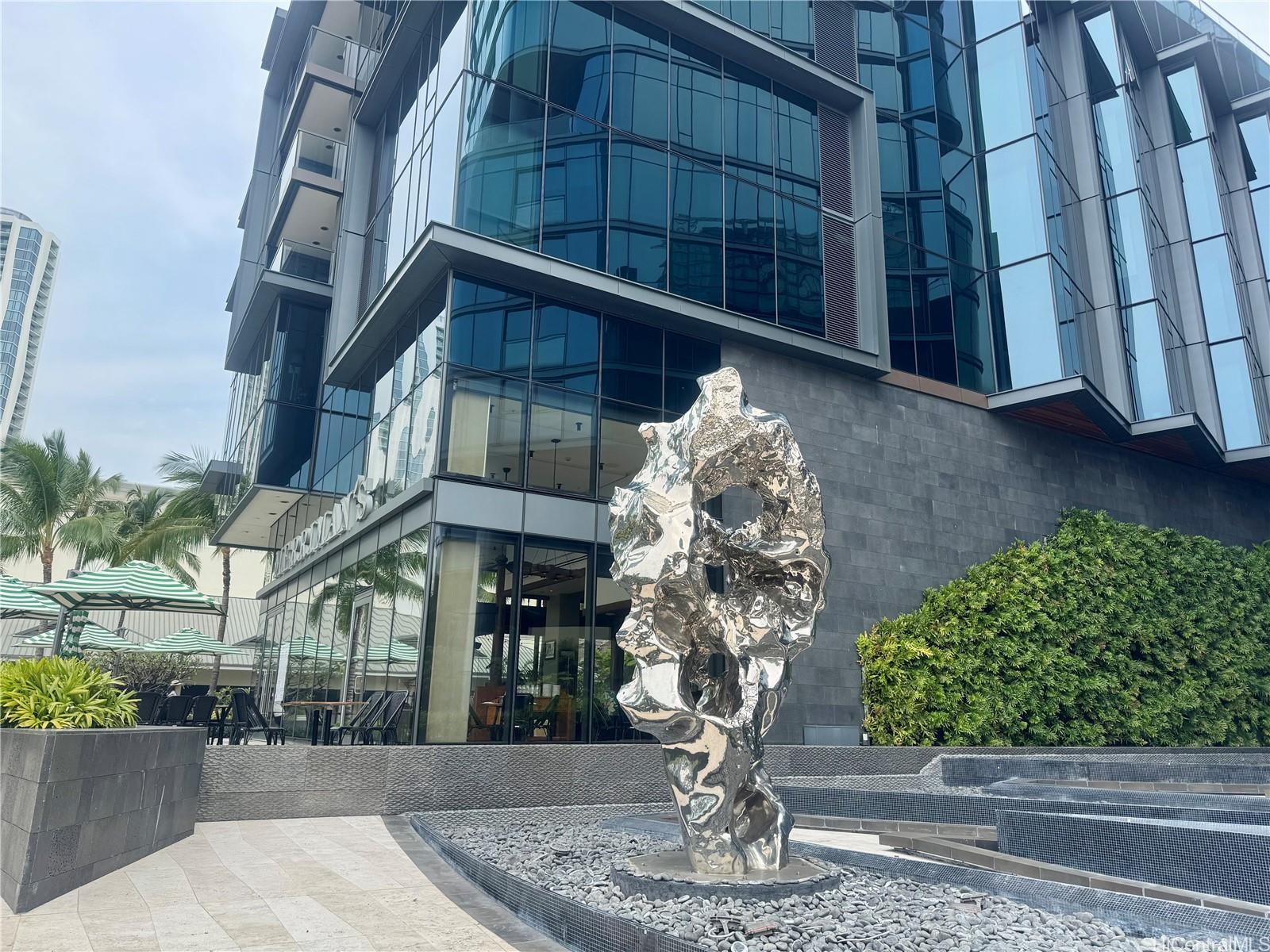 1108 Auahi Street, Unit 307 Honolulu, HI 96814 - Photo 21 of 23 a vase of flowers sitting on a table