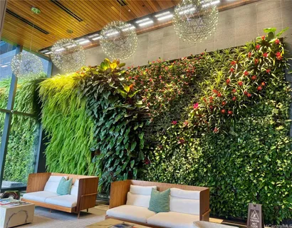 a roof deck with table and chairs and potted plants