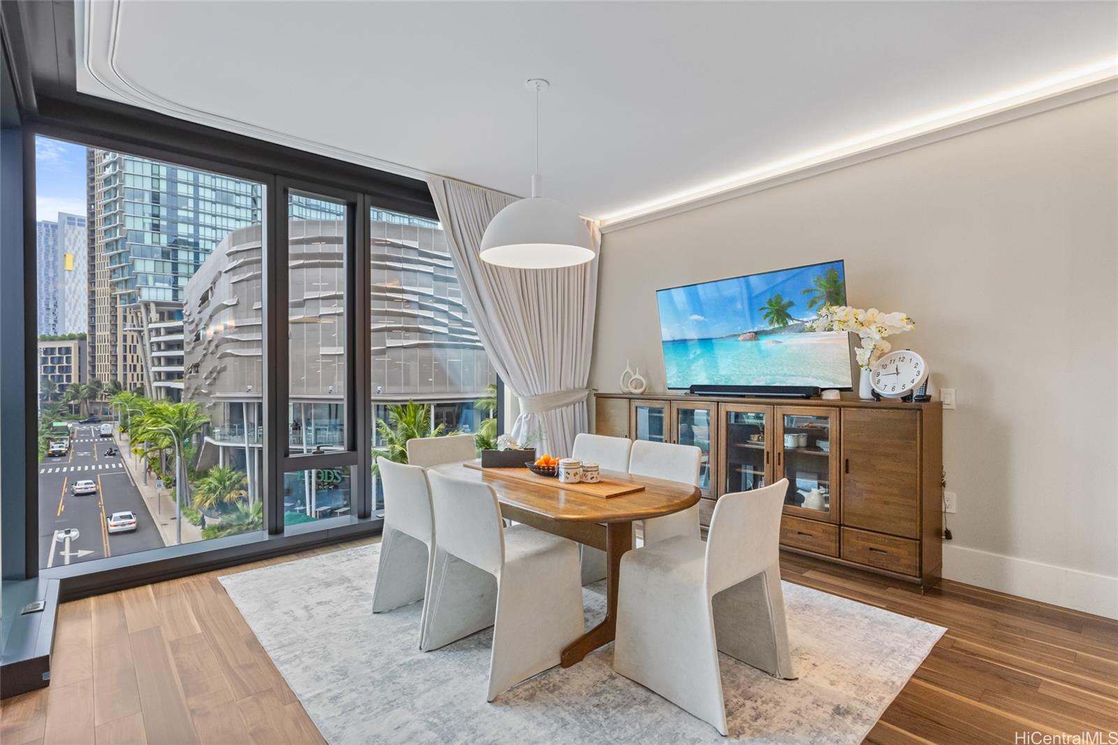 1108 Auahi Street, Unit 307 Honolulu, HI 96814 - Photo 3 of 23 a dining room with furniture and large windows