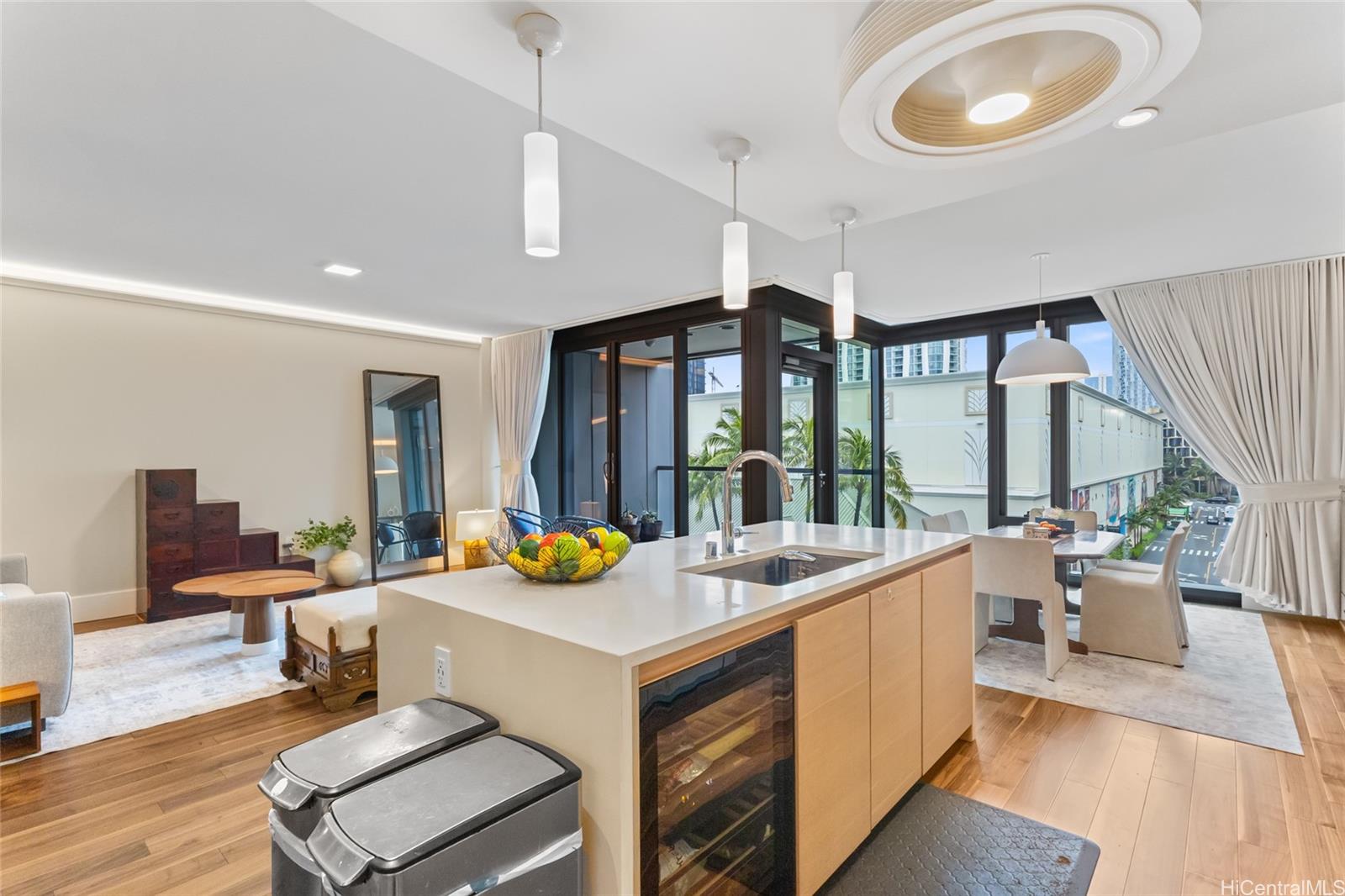 1108 Auahi Street, Unit 307 Honolulu, HI 96814 - Photo 4 of 23 a very nice looking living room with dining room and large windows