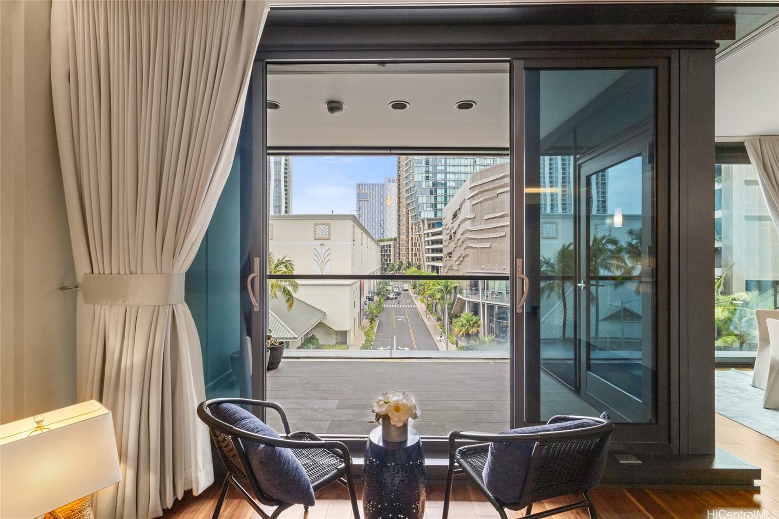 1108 Auahi Street, Unit 307 Honolulu, HI 96814 - Photo 5 of 23 a view of a chairs and table in the balcony
