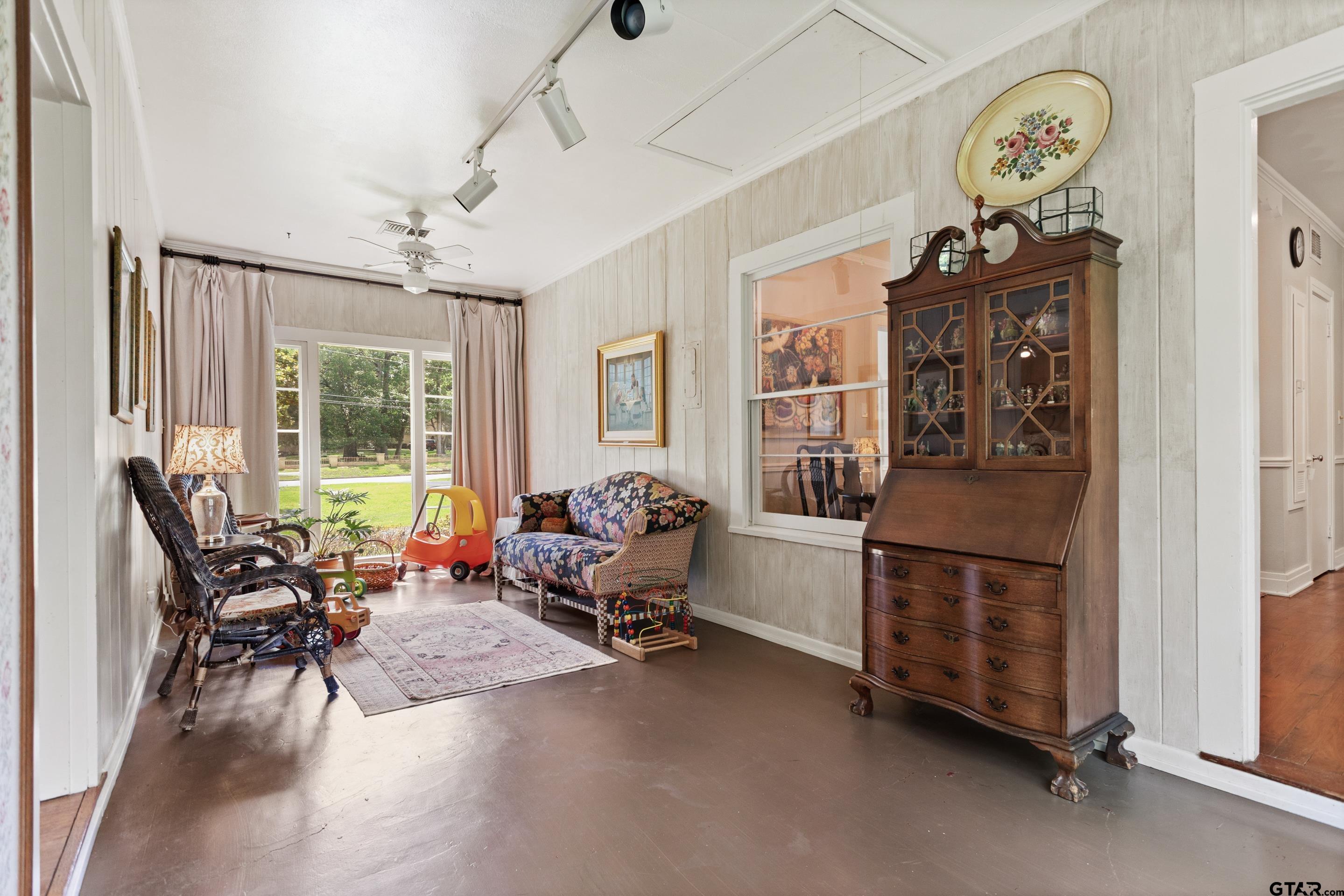 2631 Old Bullard Road Tyler, TX 75701 - Photo 32 of 43 a living room with furniture a window and a chandelier