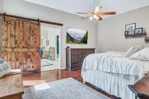 a bedroom with a bed and a fireplace