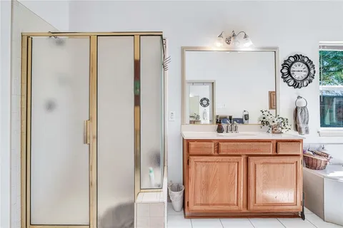 a bathroom with a sink a mirror and a light fixture