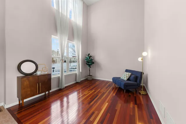 a living room with furniture a rug and a fireplace