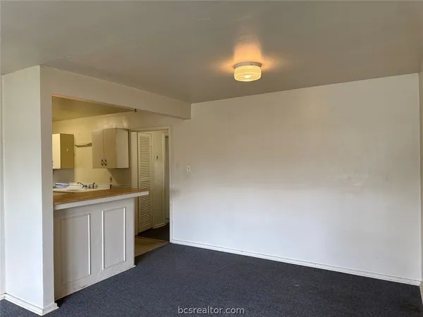 a view of a kitchen with a sink