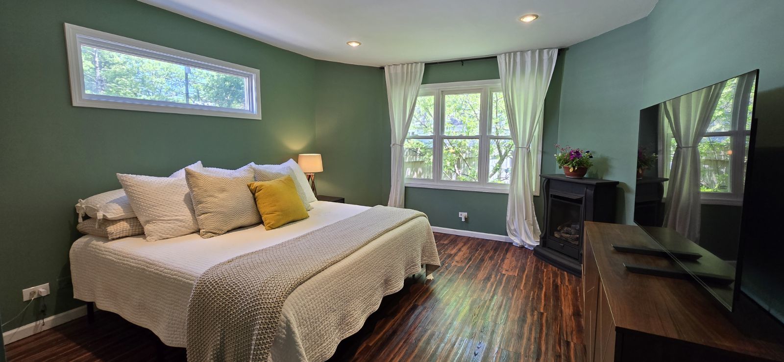 2107 Ewing Avenue Evanston, IL 60201 - Photo 15 of 36 a bedroom with bed and wooden floor