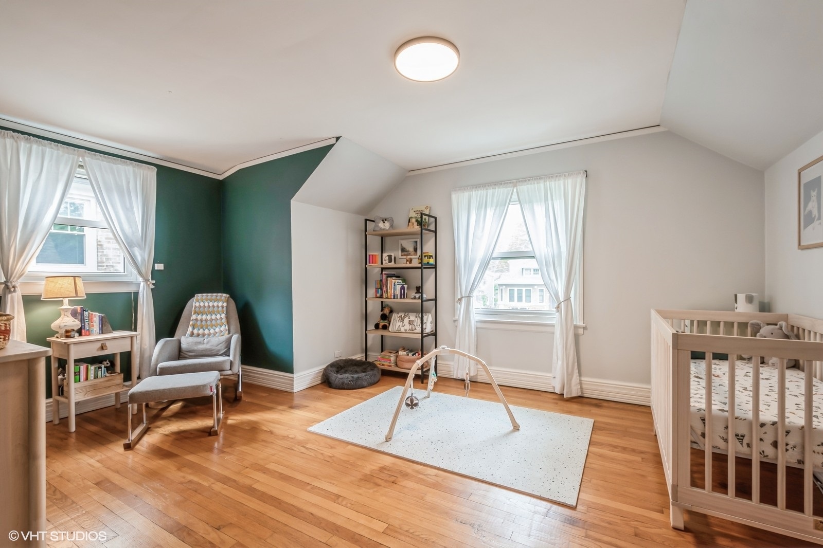 2107 Ewing Avenue Evanston, IL 60201 - Photo 20 of 36 a living room with furniture a rug and a window