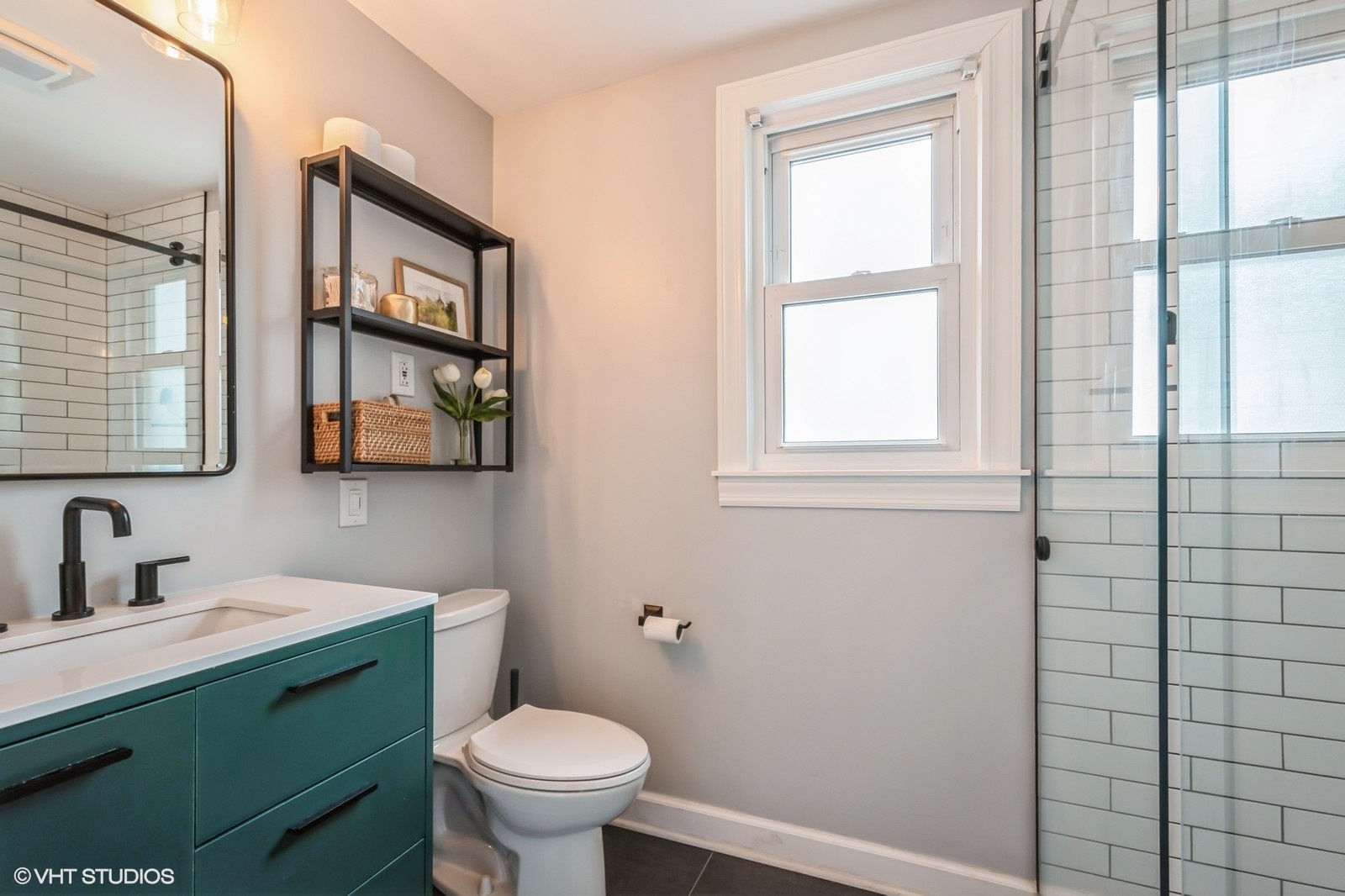 2107 Ewing Avenue Evanston, IL 60201 - Photo 22 of 36 a bathroom with a toilet sink vanity and windows