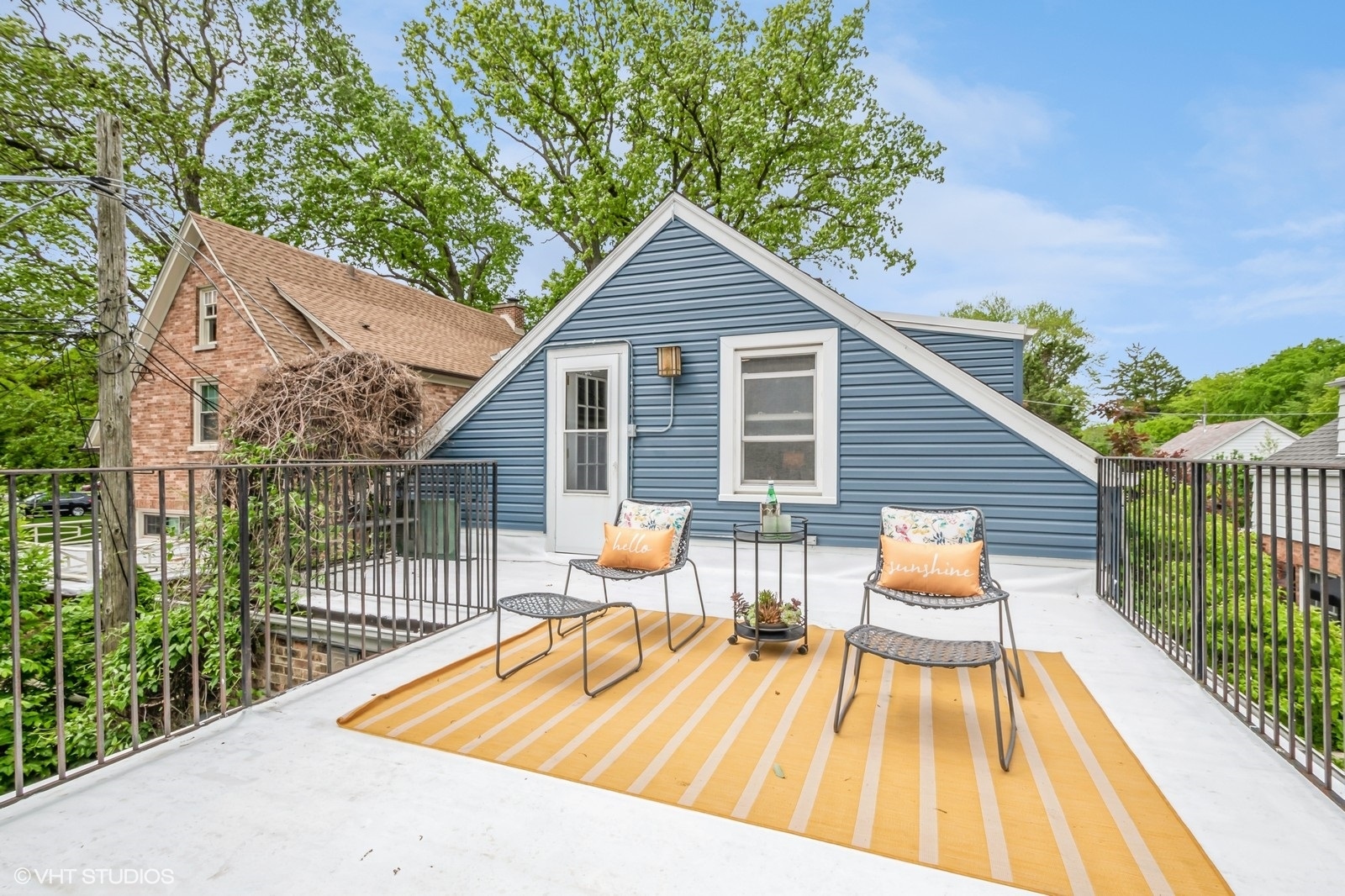 2107 Ewing Avenue Evanston, IL 60201 - Photo 27 of 36 a view of a house with wooden deck and furniture