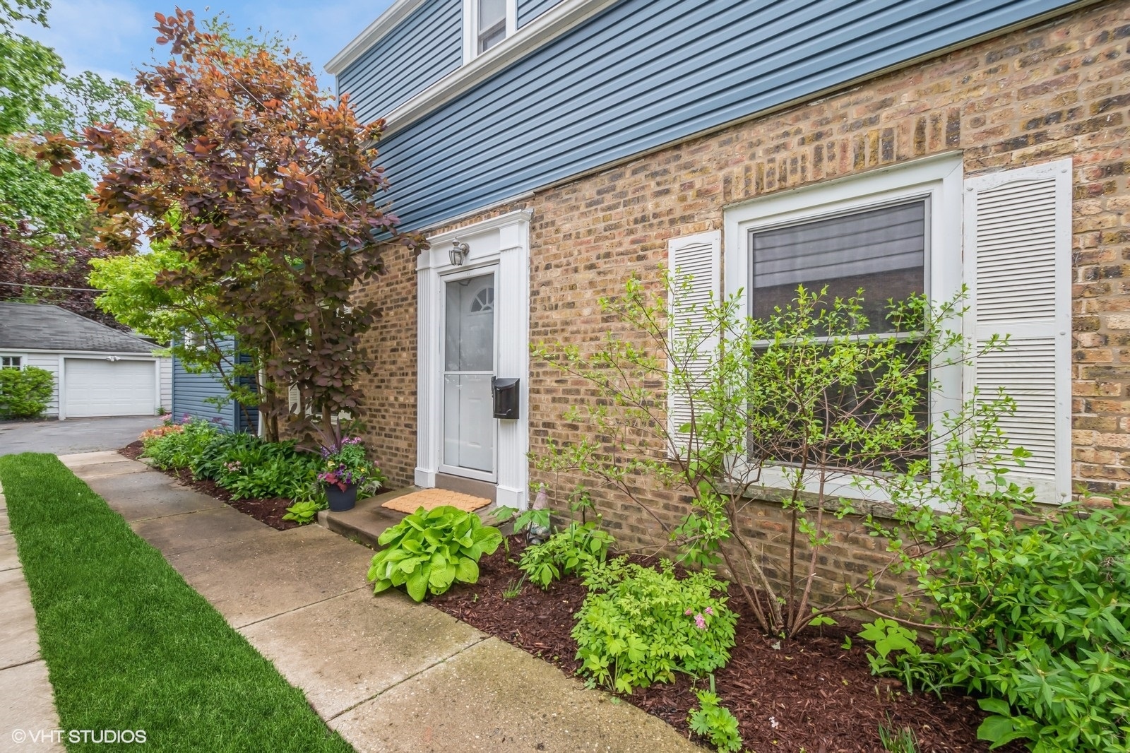 2107 Ewing Avenue Evanston, IL 60201 - Photo 3 of 36 a front view of a house with garden