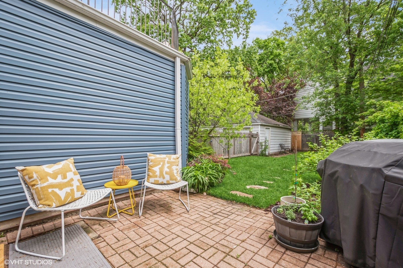 2107 Ewing Avenue Evanston, IL 60201 - Photo 33 of 36 a view of a chair and table in backyard of the house