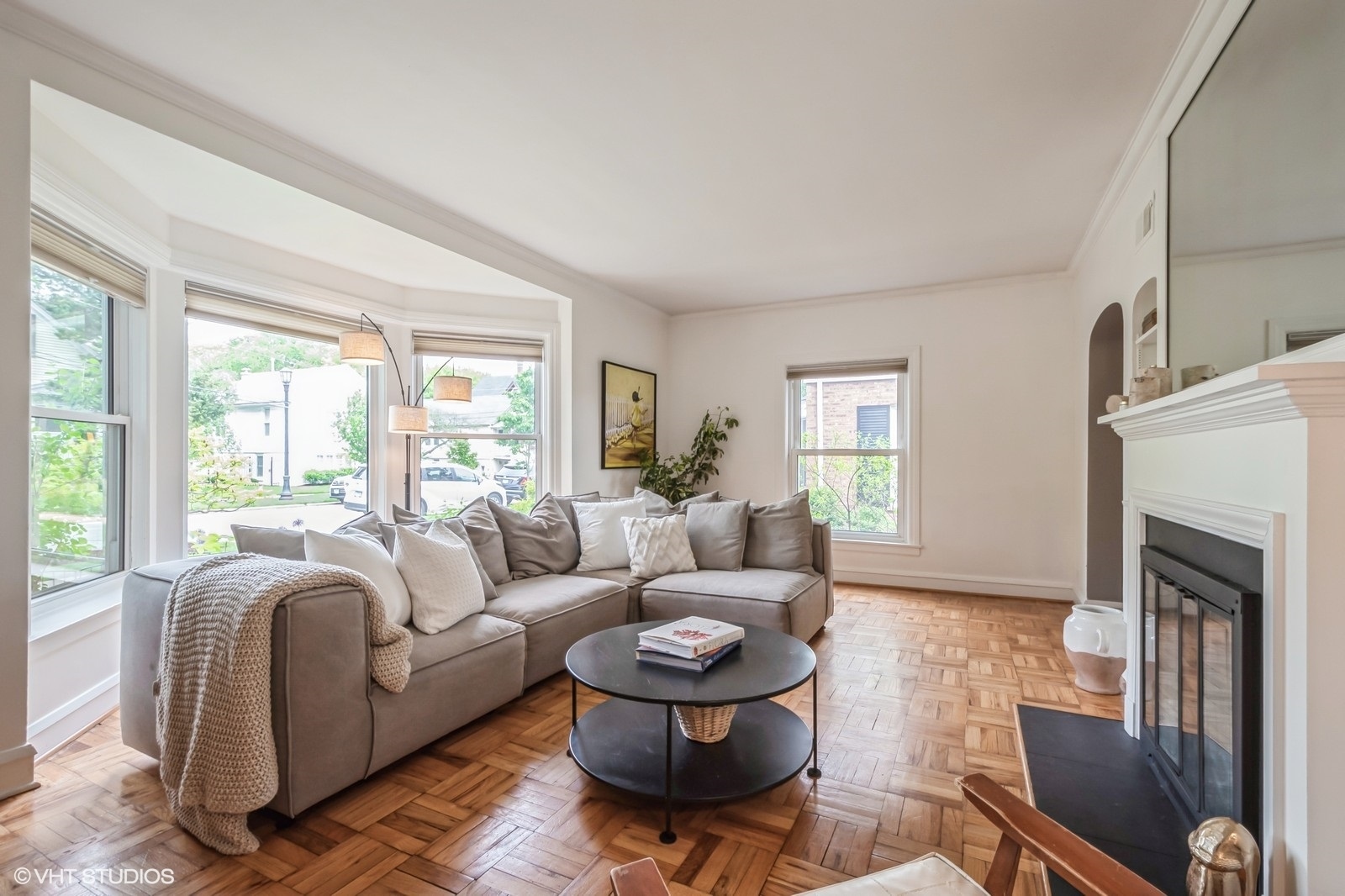 2107 Ewing Avenue Evanston, IL 60201 - Photo 6 of 36 a living room with furniture a fireplace and a large window