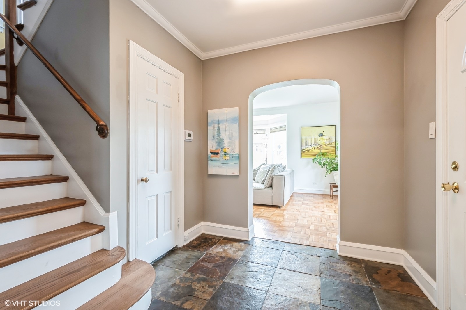 2107 Ewing Avenue Evanston, IL 60201 - Photo 8 of 36 a view of a hallway with wooden floor and a living room
