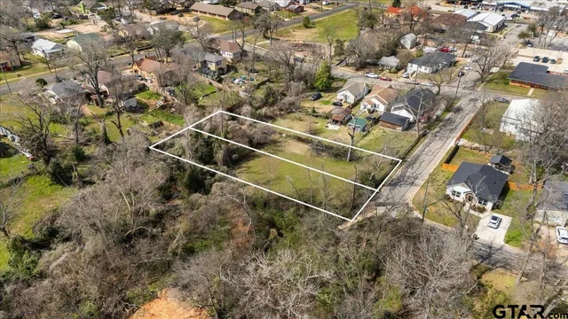 a aerial view of a house with a yard